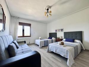 a living room with two beds and a couch at El Trocador - 12805 in Ajo