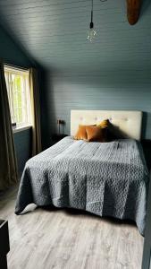 Ліжко або ліжка в номері Ladegaarden