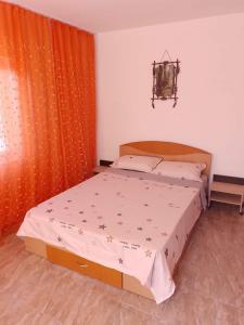 Postel nebo postele na pokoji v ubytování Casa Luminița