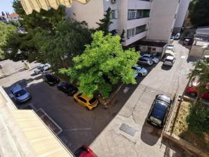 an overhead view of a parking lot with cars and a tree at Luxury apartment Galant 1 in Split