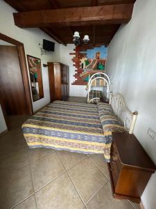 a small bedroom with a bed and a table at Quietovivere in Lido di Spina +27 photos