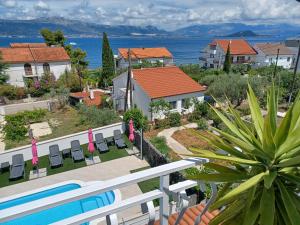 a view from the balcony of a house with a swimming pool at Apartments MajaPaula in Slatine