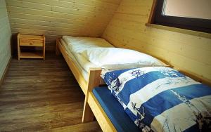 Postel nebo postele na pokoji v ubytování Jaśminowa Przystań