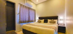 Nova Hotel New Crossroad客房内的一张或多张床位