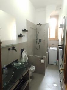 a bathroom with a shower and a sink and a toilet at Testaccio Bodoni apartment in Rome
