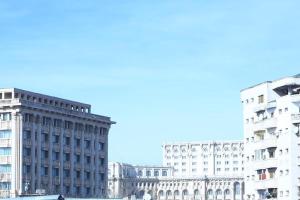 a group of buildings in a city with at Liveni 22 in Bucharest