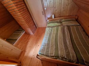 an overhead view of a bed in a cabin at Lodge In Koprivnik in Koprivnik v Bohinju