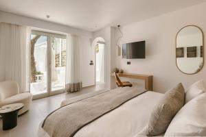 Cama ou camas em um quarto em Grace Mykonos