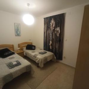 Postel nebo postele na pokoji v ubytování Casa Sol y montaña-habitaciones