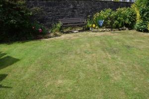 a park bench sitting in the middle of a yard at One Marine Place in Port Bannatyne +6 photos