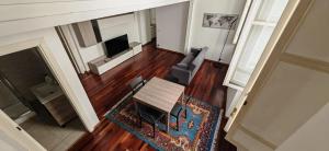 an overhead view of a living room with a table and chairs at MS Piazza del Papa Sea Port in Ancona