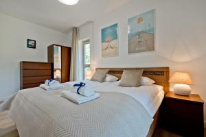 Katil atau katil-katil dalam bilik di BlueApart Apartamenty Jurata