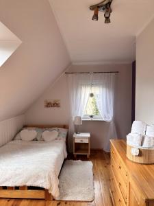 Ένα ή περισσότερα κρεβάτια σε δωμάτιο στο Apartament Mazurskie Ciepło