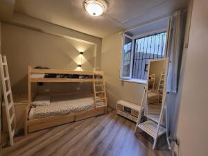 a bedroom with two bunk beds and a window at Primo Passo The Lorax in Arco