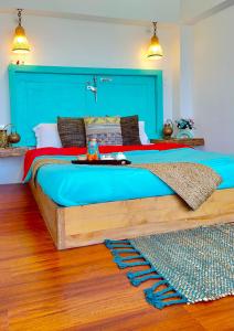 מיטה או מיטות בחדר ב-Nirvana Homes Rarta