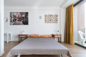 Posteľ alebo postele v izbe v ubytovaní Loft moderno con balcón al lado de Las Canteras + 9 fotografií