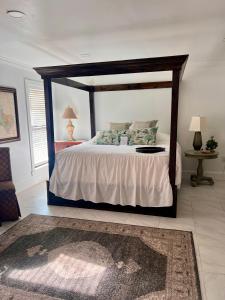 a bedroom with a large bed with a wooden frame at The Savannah Suite in Winona