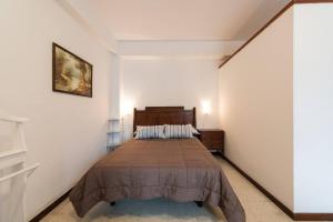 Postel nebo postele na pokoji v ubytování Loft luminoso y espacioso al lado de Las Canteras + 16 fotografií