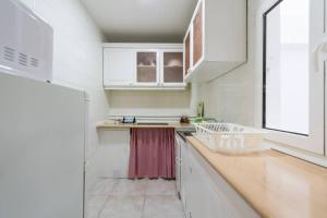 Kuchyň nebo kuchyňský kout v ubytování Loft luminoso y espacioso al lado de Las Canteras