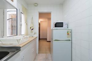 Kuchyň nebo kuchyňský kout v ubytování Loft luminoso y espacioso al lado de Las Canteras