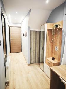 a room with a hallway with a wooden door at The Skeptic Home in Thessaloniki +27 photos