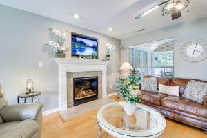 a living room with a couch and a fireplace at Home Sweet Home with Private Pool and Patio! in Knoxville