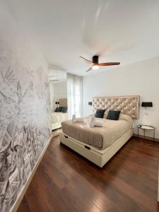 a bedroom with a bed and a ceiling fan at WeRentVLC - Design Ruzafa - Top location in Valencia