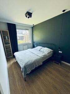 Postel nebo postele na pokoji v ubytování Apartament Sosnowy Zakątek