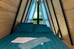 a bed in a room with a window at Paradise Keda in Keda