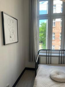 Posteľ alebo postele v izbe v ubytovaní Apartament Mikolowska 9