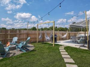 a backyard with a hammock and a swing set at Wildflower Wanderlust-Glamping st 1885 Farms in Navarre