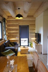 TV a/nebo společenská místnost v ubytování Tiefenbach-Chalet