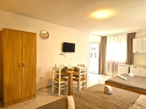 a room with a table and a dining room at IVANA Apartments in Ulcinj