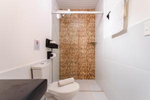 a bathroom with a toilet and a shower at Pousada Principal in Jericoacoara