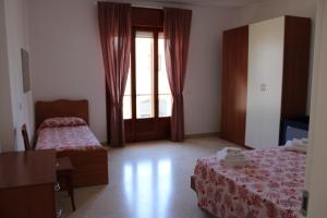 A bed or beds in a room at Villa Maria