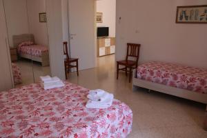 A bed or beds in a room at Villa Maria