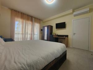 Postel nebo postele na pokoji v ubytování Urban Suite Milano