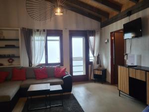 Televiisor ja/või meelelahutuskeskus majutusasutuses Hotel Platten Apartment