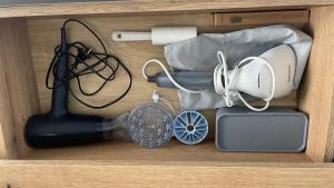 a drawer with a blender and other kitchen items at Przno Apartment Most Oliva in Vrijesno