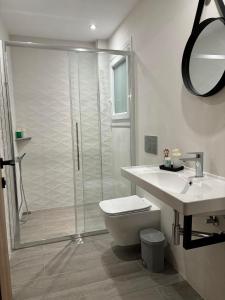 a bathroom with a shower and a toilet and a sink at ΚΟΧΥΛΙ in Ierissos +18 photos