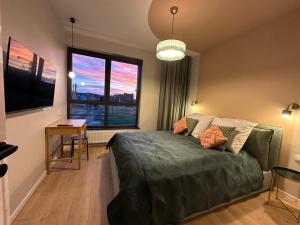 Posteľ alebo postele v izbe v ubytovaní Doki STARling Apartment