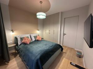 Posteľ alebo postele v izbe v ubytovaní Doki STARling Apartment