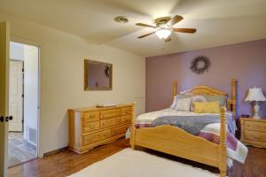 a bedroom with a bed and a ceiling fan at Chic Silver City Getaway with Patio and Gas Grill in Silver City