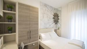 Posteľ alebo postele v izbe v ubytovaní Hotel Lux