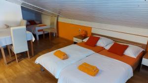 Postel nebo postele na pokoji v ubytování Apartments Kivi