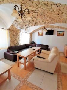 a living room with a couch and a table at Chata Porubka in Liptovský Mikuláš
