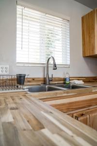 a kitchen with a sink and a window at Swiss Holiday Lodge in Mount Shasta