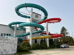 a water slide in front of a building at Darba 2 in Darłowo