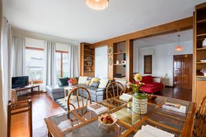 a living room with a couch and a table at Villa Infinito Blu in Borgio Verezzi