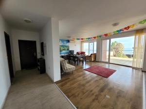 a living room with a dining room and a living room with at SKY INFINITY in Balchik